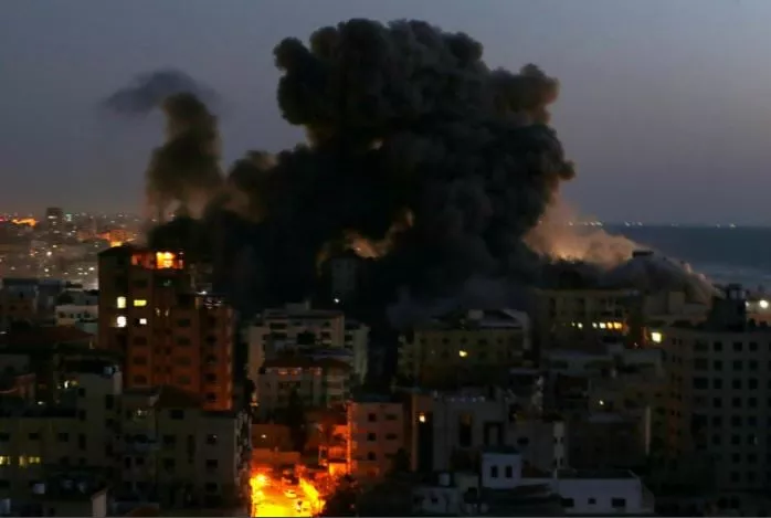 smoke rises from a building after it was destroyed by israeli air strikes amid a flare up of israeli palestinian violence in gaza may 11 2021 photos reuters afp smoke rises from a building after it was destroyed by israeli air strikes amid a flare up of israeli palestinian violence in gaza may 11 2021 photos reuters afp