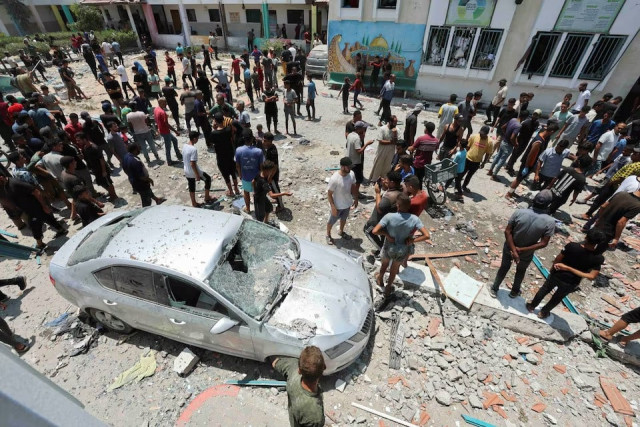 palestinians inspect a school following an israeli strike in deir al balah central gaza strip july 27 2024 photo reuters palestinians inspect a school following an israeli strike in deir al balah central gaza strip july 27 2024 photo reuters