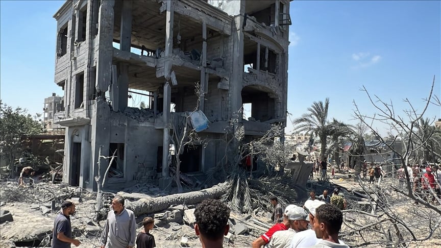 palestinians inspect the area after an israeli attack hits displaced people s camps in al mawasi khan yunis