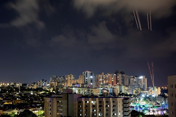 Rockets are launched from the Gaza Strip towards Israel, as seen from Ashkelon, in southern Israel. PHOTO: Reuters