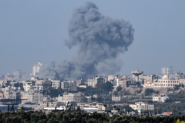 This picture taken from Israel's southern city of Sderot shows smoke billowing over the northern Gaza Strip during brutal Israeli bombardment. PHOTO: AFP