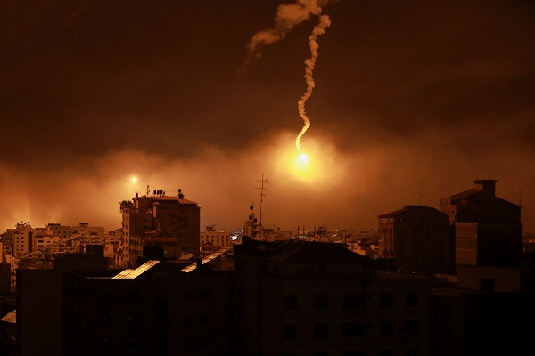 Flares are fired by Israeli forces over Gaza. PHOTO: Reuters