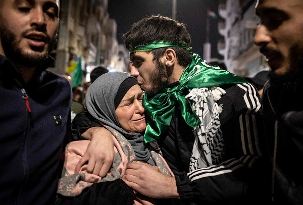 A Palestinian prisoner hugs his mother after being released from an Israeli jail. PHOTO: AFP