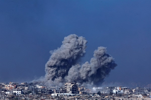 Smoke and debris rises over Gaza as seen from southern Israel. PHOTO: Reuters
