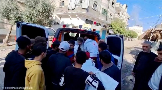paramedics from the palestine red crescent society along with others place bodies covered in white sheets inside an ambulance following an airstrike on a house in central gaza photo reuters paramedics from the palestine red crescent society along with others place bodies covered in white sheets inside an ambulance following an airstrike on a house in central gaza photo reuters
