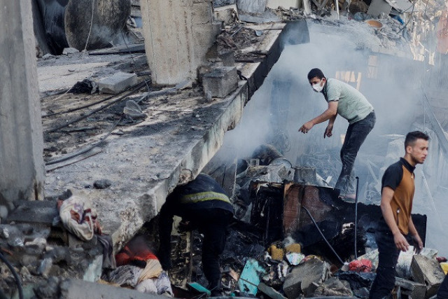 palestinians search for casualties under the rubble in the aftermath of israeli strikes photo reuters palestinians search for casualties under the rubble in the aftermath of israeli strikes photo reuters