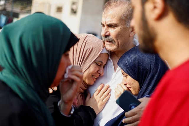 people mourn as they attend a funeral of palestinians killed in israeli strikes photo reuters people mourn as they attend a funeral of palestinians killed in israeli strikes photo reuters