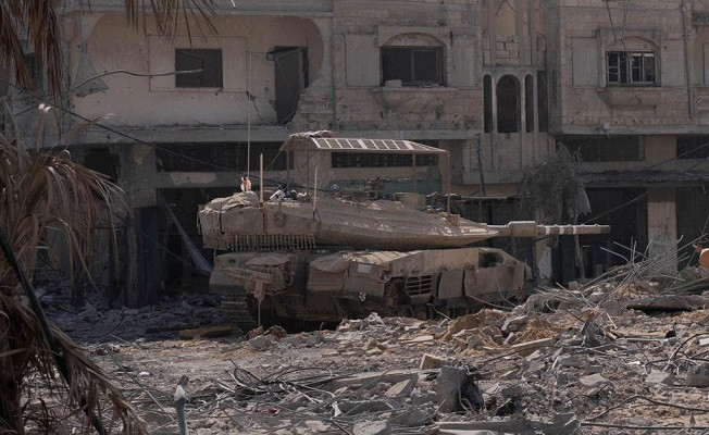 An Israeli tank is seen inside Gaza. PHOTO: Reuters