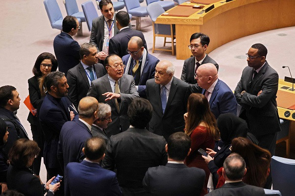 palestinian ambassador to the united nations riyad mansour 4th r listens to members of the un security council as they break during a meeting on the israel hamas conflict at the united nations headquarters on december 19 photo afp