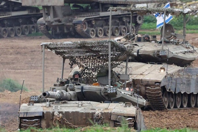 israeli army tanks manoeuvre near the israel gaza border photo reuters israeli army tanks manoeuvre near the israel gaza border photo reuters