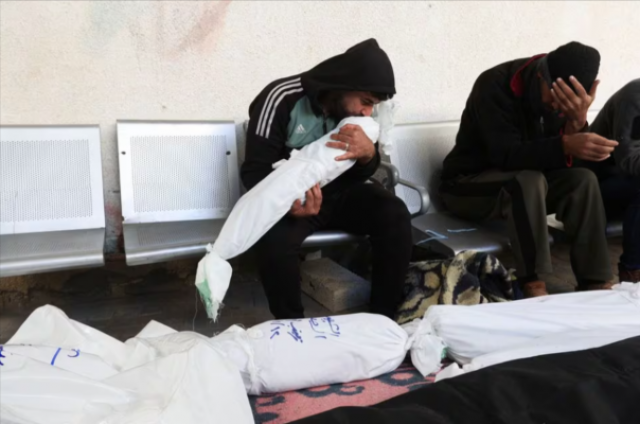 a man kisses the body of his child killed in an israeli strike at abu yousef al najjar hospital in rafah photo reuters a man kisses the body of his child killed in an israeli strike at abu yousef al najjar hospital in rafah photo reuters