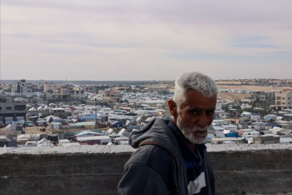 a man looks on near a tent camp where displaced palestinians who fled their houses due to israeli strikes take shelter in rafah in the southern gaza strip photo reuters