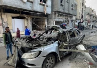 onlookers check the car in which three sons of hamas leader ismail haniyeh were reportedly killed in an israeli air strike in al shati camp west of gaza city photo afp