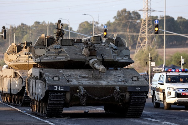 Israeli tanks seen on a road near Israel's border with the Gaza Strip. PHOTO: Reuters