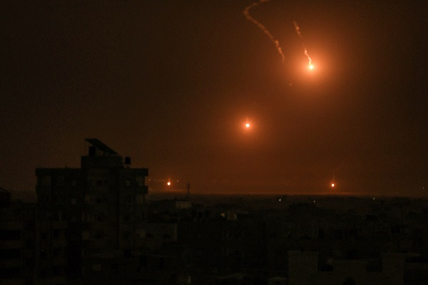 Flares fired by the Israeli army light up the sky east of Khan Yunis in the southern Gaza Strip. PHOTO: AFP