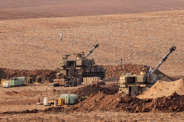 Israeli army artillery howitzers are stationed at a position along the border with the Gaza Strip in southern Israel. PHOTO: AFP