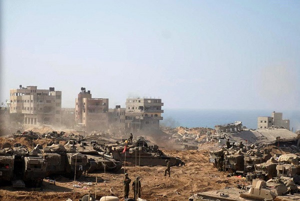 Israeli tanks and soldiers stationed at a location in the northern Gaza Strip. PHOTO: AFP