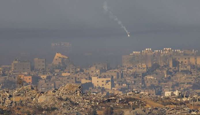 A light falls over Gaza as seen from southern Israel. PHOTO: Reuters