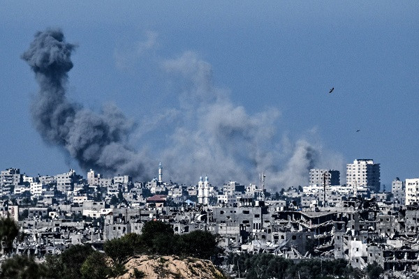 A picture taken from the Israeli side of the border with the Gaza Strip shows smoke rising over the norther-western part of the Palestinian enclave during an Israeli bombing attack. PHOTO: AFP
