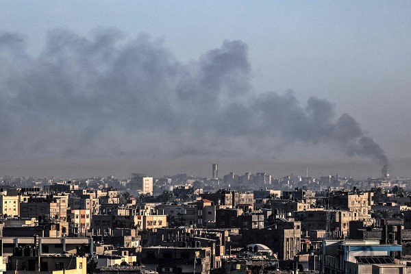 A picture taken from Rafah on January 6, 2024 shows smoke billowing over Khan Yunis in the southern Gaza Strip during Israeli bombardment. PHOTO: AFP