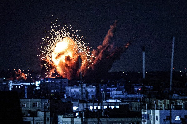 A ball of fire and smoke rise above buildings during an Israeli strike on Rafah in the southern Gaza Strip. PHOTO: AFP