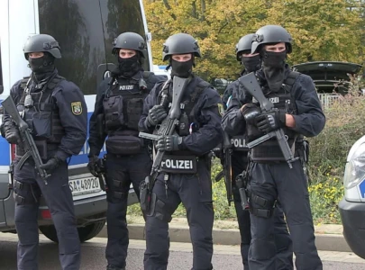 berlin police arrest four after attack on social democrat activists