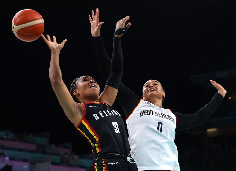 satou sabally of germany white in action against maxuella lisowa mbaka of belgium during basketball women s group c match of paris 2024 olympics played at lille pierre mauroy stadium villeneve d ascq france on july 29 2024 photo reuters