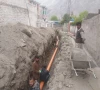 labourer s laying down pipes for gilgit s sewerage and sanitation project photo express