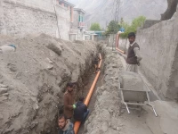 labourer s laying down pipes for gilgit s sewerage and sanitation project photo express