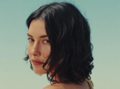 gracie abrams embraces assh    of the year award in i love you i m sorry music video