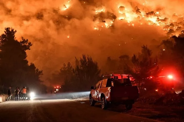 flames rise as firefighters and volunteers try to extinguish a fire burning in the village of schinos near corinth greece may 19 2021 photo reuters flames rise as firefighters and volunteers try to extinguish a fire burning in the village of schinos near corinth greece may 19 2021 photo reuters