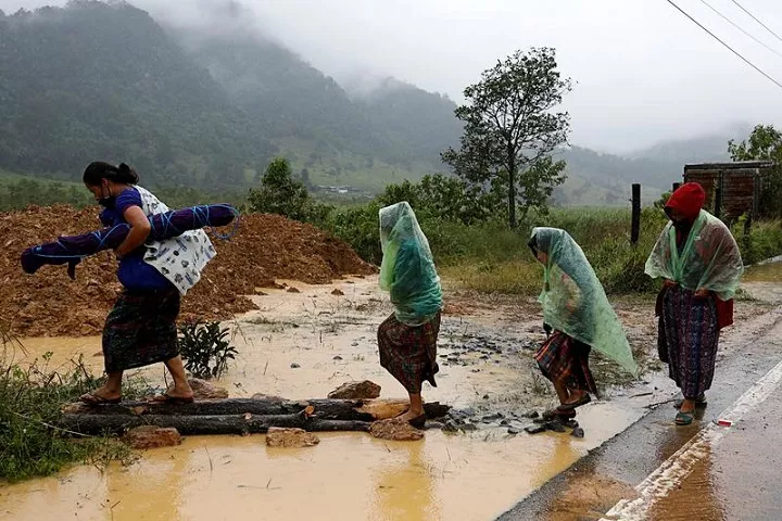 women walk at an area affected by a mudslide after the passage of storm eta in purulha baja verapaz guatemala november 6 2020 photo reuters women walk at an area affected by a mudslide after the passage of storm eta in purulha baja verapaz guatemala november 6 2020 photo reuters