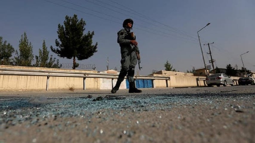 an afghan policeman stands guard after an attack at the american university of afghanistan in kabul photo reuters