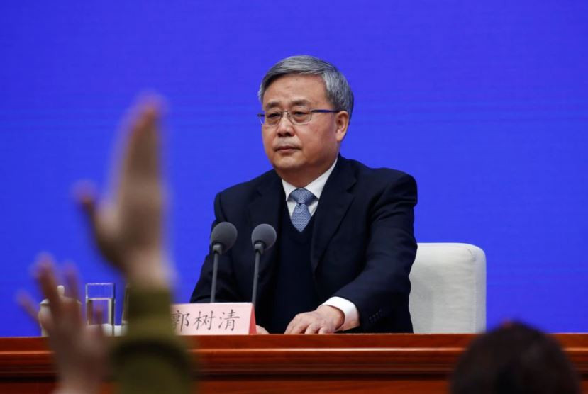 guo shuqing chairman of the china banking and insurance regulatory commission cbirc attends a news conference in beijing china march 2 2021 photo reuters file
