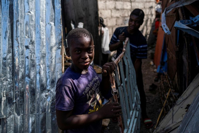 boys working at a metal recycler carry metal scavenged from houses destroyed in a 7 2 magnitude quake in les cayes haiti august 21 2021 photo reuters boys working at a metal recycler carry metal scavenged from houses destroyed in a 7 2 magnitude quake in les cayes haiti august 21 2021 photo reuters