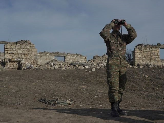 an ethnic armenian soldier looks through binoculars as he stands at fighting positions near the village of taghavard in the region of nagorno karabakh january 11 2021 photo reuters file an ethnic armenian soldier looks through binoculars as he stands at fighting positions near the village of taghavard in the region of nagorno karabakh january 11 2021 photo reuters file
