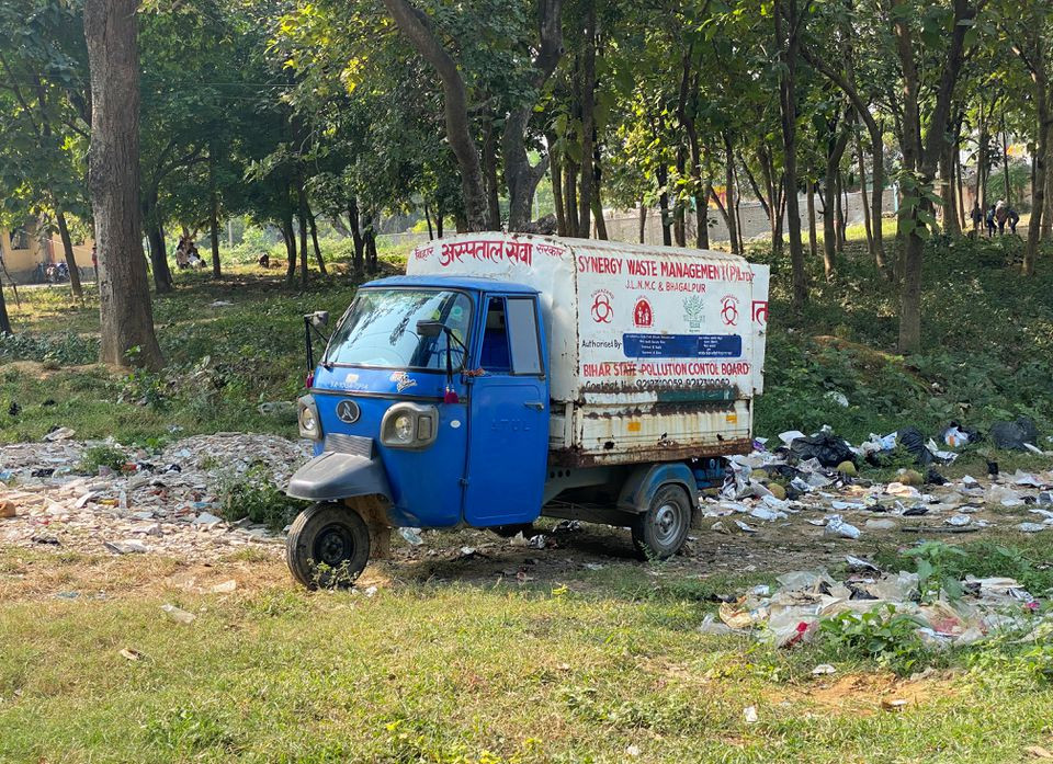 A three-wheeled vehicle used for waste disposal is seen parked near the perimeter wall of the Jawaharlal Nehru Medical College and Hospital in Bhagalpur district in the eastern state of Bihar, India, November 12, 2021. Picture taken November 12, 2021. REUTERS