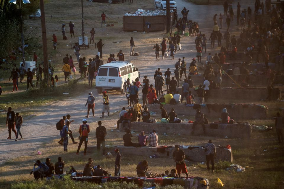 migrants seeking asylum in the u s rest near the international bridge between mexico and the u s as they wait to be processed in del rio texas u s september 16 2021 photo reuters