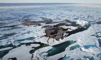 an aerial view of a tiny island off the coast of greenland revealed by shifting pack ice photo reuters