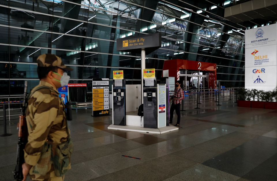 a man checks the scan fly kiosks after the government allowed domestic flight services to resume from coming monday during an extended nationwide lockdown to slow the spread of the coronavirus disease covid 19 at the indira gandhi international igi airport in new delhi india may 23 2020 photo reuters file