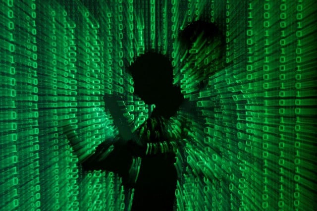 an illustration picture shows a projection of binary code on a man holding a laptop computer in an office in warsaw june 24 2013 photo reuters an illustration picture shows a projection of binary code on a man holding a laptop computer in an office in warsaw june 24 2013 photo reuters
