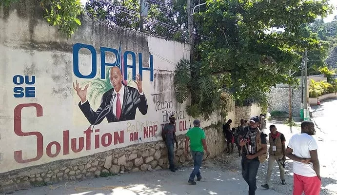 people walk past a wall with a mural depicting haiti s president jovenel moise after he was shot dead by unidentified attackers in his private residence in port au prince haiti july 7 2021 photo reuters people walk past a wall with a mural depicting haiti s president jovenel moise after he was shot dead by unidentified attackers in his private residence in port au prince haiti july 7 2021 photo reuters