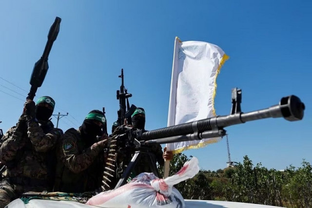 palestinian fighters from the armed wing of hamas take part in a military parade near the border in the central gaza strip july 19 2023 photo reuters palestinian fighters from the armed wing of hamas take part in a military parade near the border in the central gaza strip july 19 2023 photo reuters