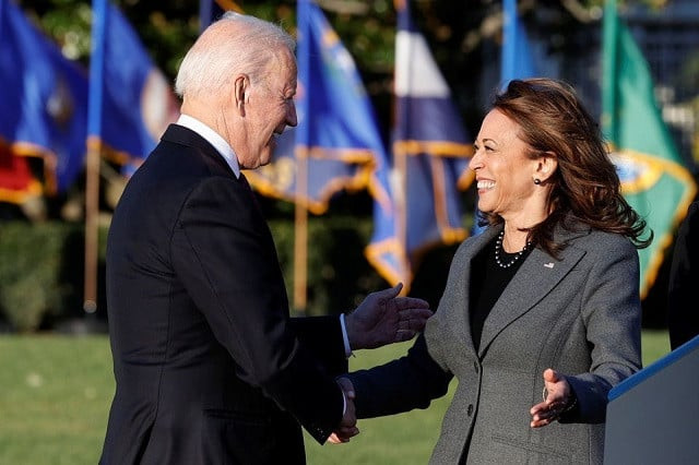 us president joe biden and vice president kamala harris shake hands during a ceremony to sign the infrastructure investment and jobs act on the south lawn at the white house in washington u s november 15 2021 photo reuters us president joe biden and vice president kamala harris shake hands during a ceremony to sign the infrastructure investment and jobs act on the south lawn at the white house in washington u s november 15 2021 photo reuters