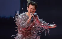 harry styles returns with three word message for fans after two year hiatus