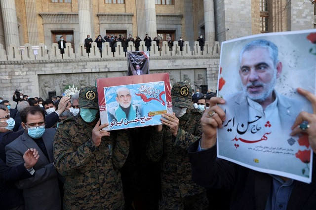 members of iranian forces carry the coffin of iran s ambassador to yemen hasan irlu during a funeral ceremony in tehran iran december 21 2021 photo reuters