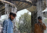 pakistani residents cool off during an hot summer day in karachi photo afp