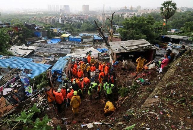 rescue workers search for survivors after a residential house collapsed due to landslide caused by heavy rainfall in mumbai india july 18 2021 photo reuters