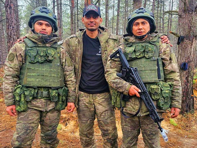 hemil mangukiya middle poses for a photograph with two other men in military uniform in this undated handout picture photo reuters