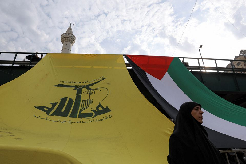 a woman looks on as hezbollah supporters protest in solidarity with palestinians in gaza beirut lebanon october 27 2023 photo reuters
